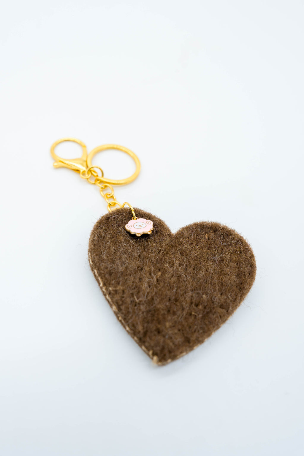 Sheepy Life wool bag charm with pink sheep and gold-toned clasp