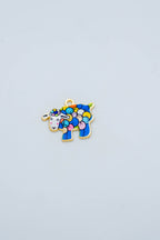 Multi-colored sheep charm on gold-backing close up