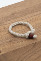 handmade wool bracelet from Apricot the Shetland sheep on a wooden background