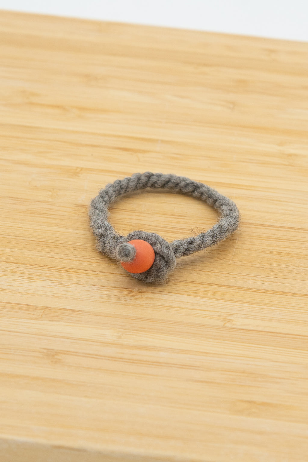Light gray wool bracelet handmade from Eddie the ram's natural Shetland wool