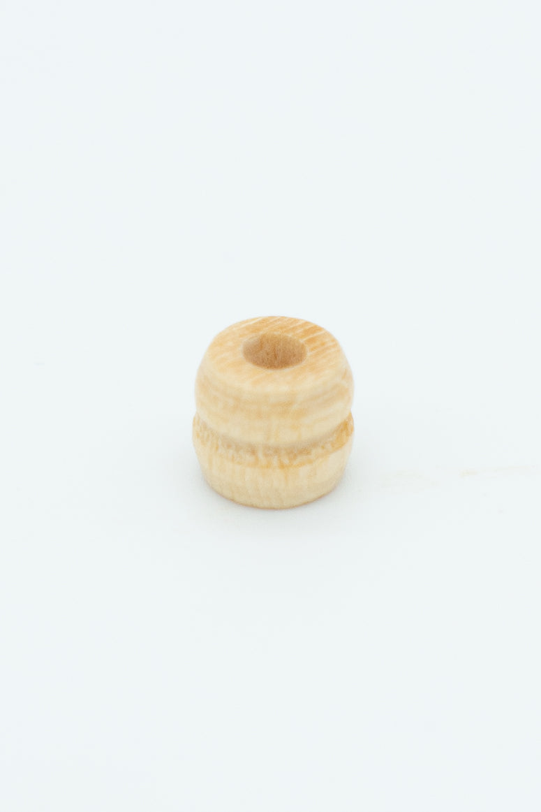 Natural ribbed wooden bead solo image for a wool bracelet