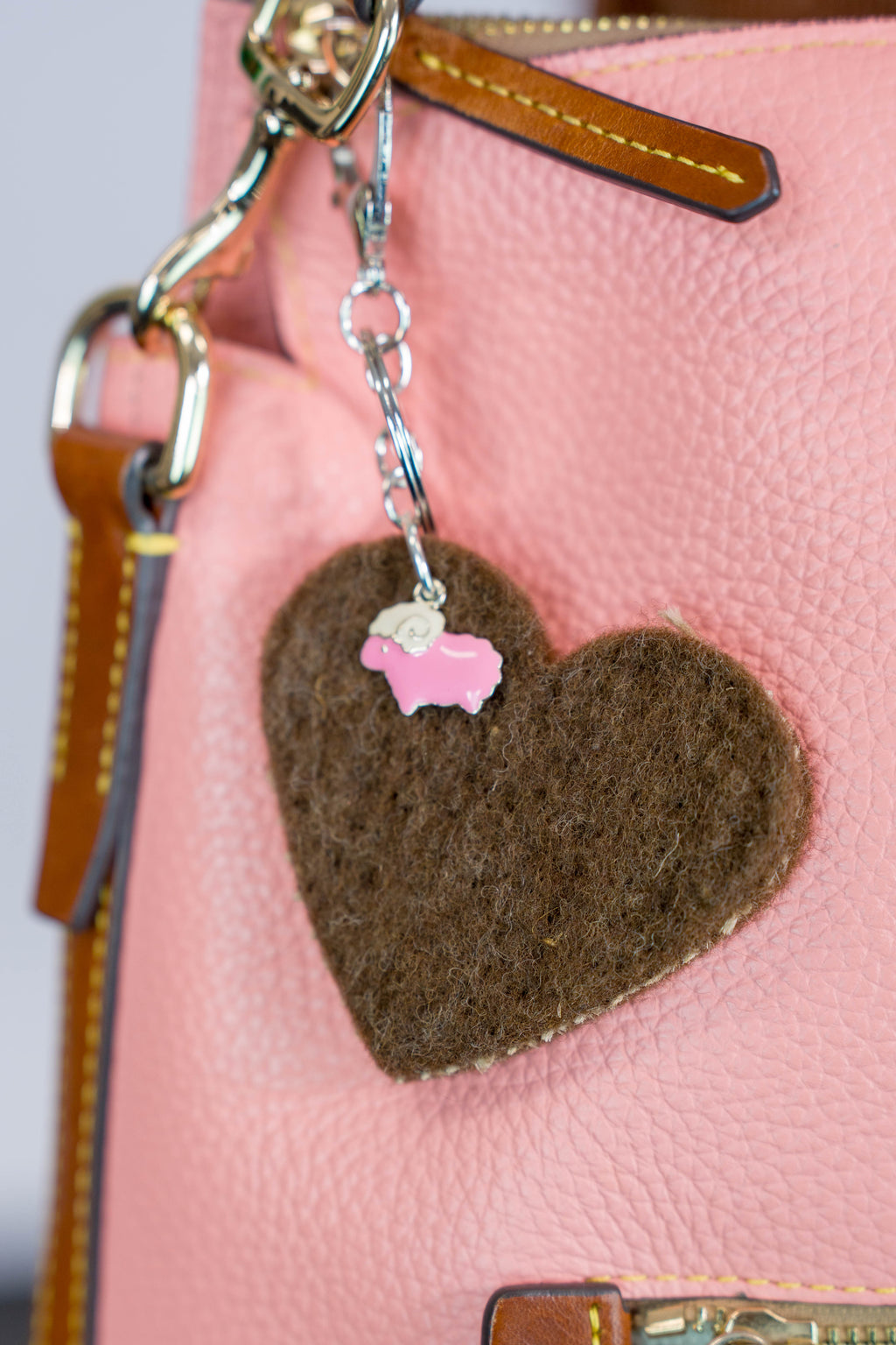 Brown felt heart bag charm with pink sheep on a pink purse